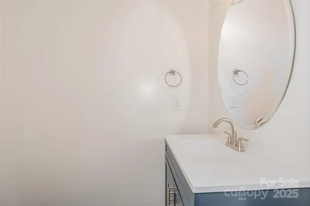 a bathroom with a sink and mirror