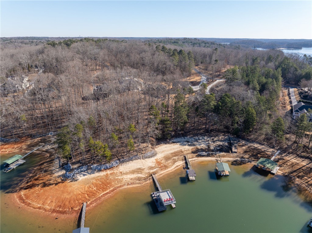 505 Northview Court Fair Play, SC 29643 - Photo 5 of 48 This captivating aerial view showcases a scenic lakefront property with private docks and lush surrounding woods.