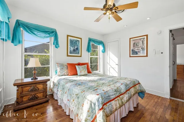 a bedroom with a bed and a tv