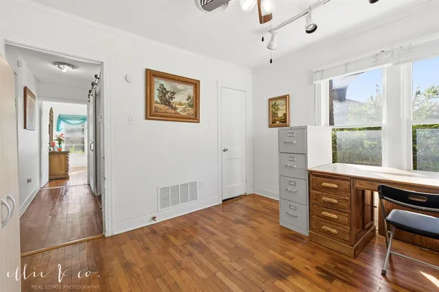 a view of a livingroom with wooden floor