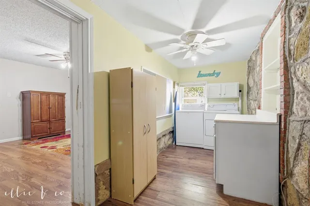 a kitchen with a refrigerator a sink and cabinets
