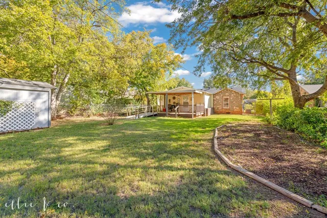 a view of yard with swimming pool