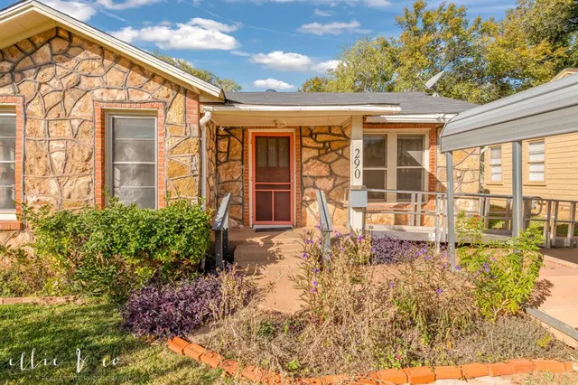 front view of a house with a large window