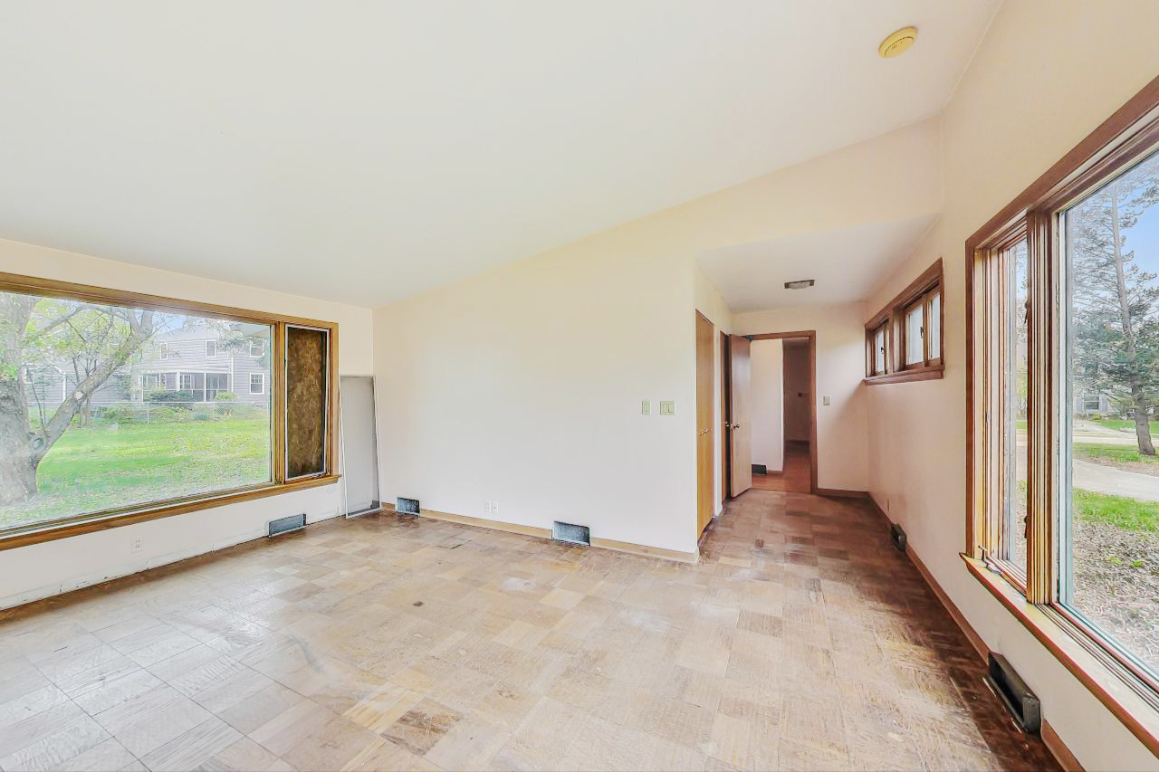 246 Miller Avenue DeKalb, IL 60115 - Photo 29 of 56 a view of an empty room with a large window