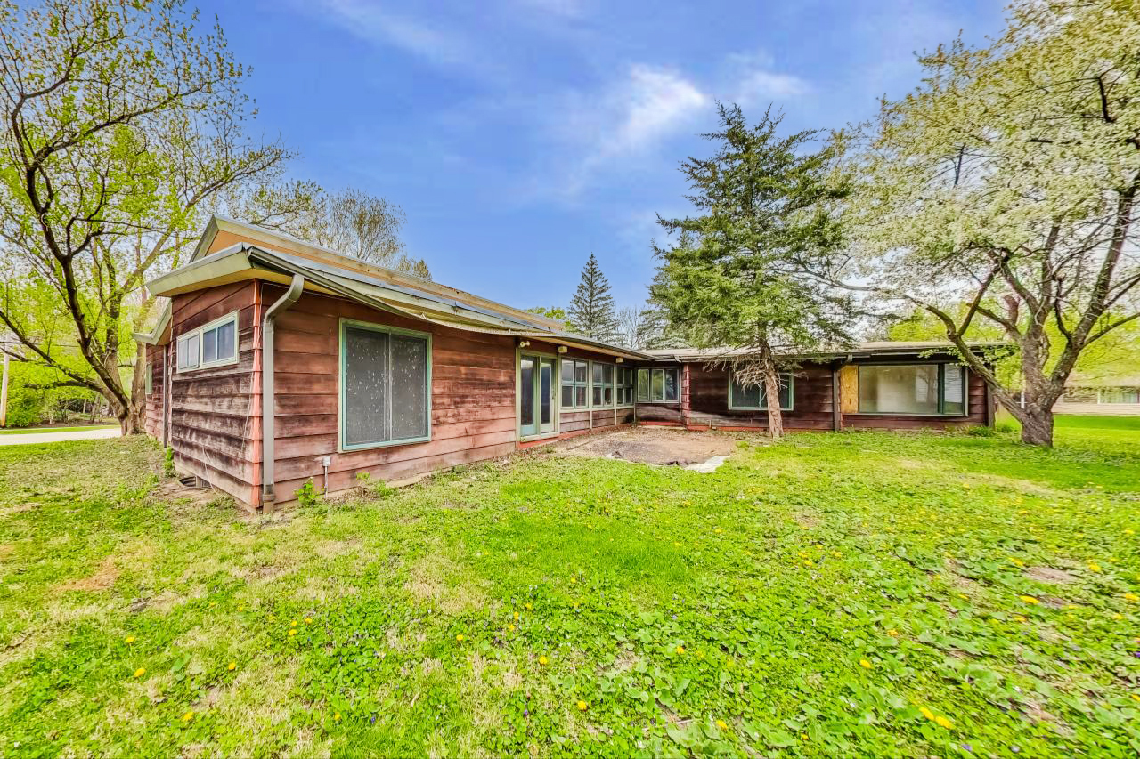 246 Miller Avenue DeKalb, IL 60115 - Photo 49 of 56 a front view of a house with a garden