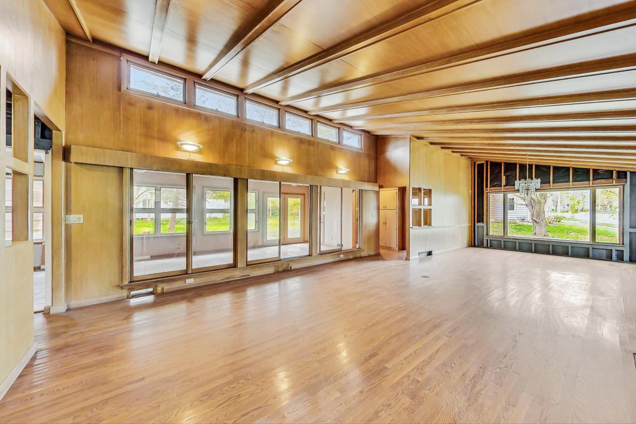 246 Miller Avenue DeKalb, IL 60115 - Photo 10 of 56 a view of empty room with wooden floor and fan