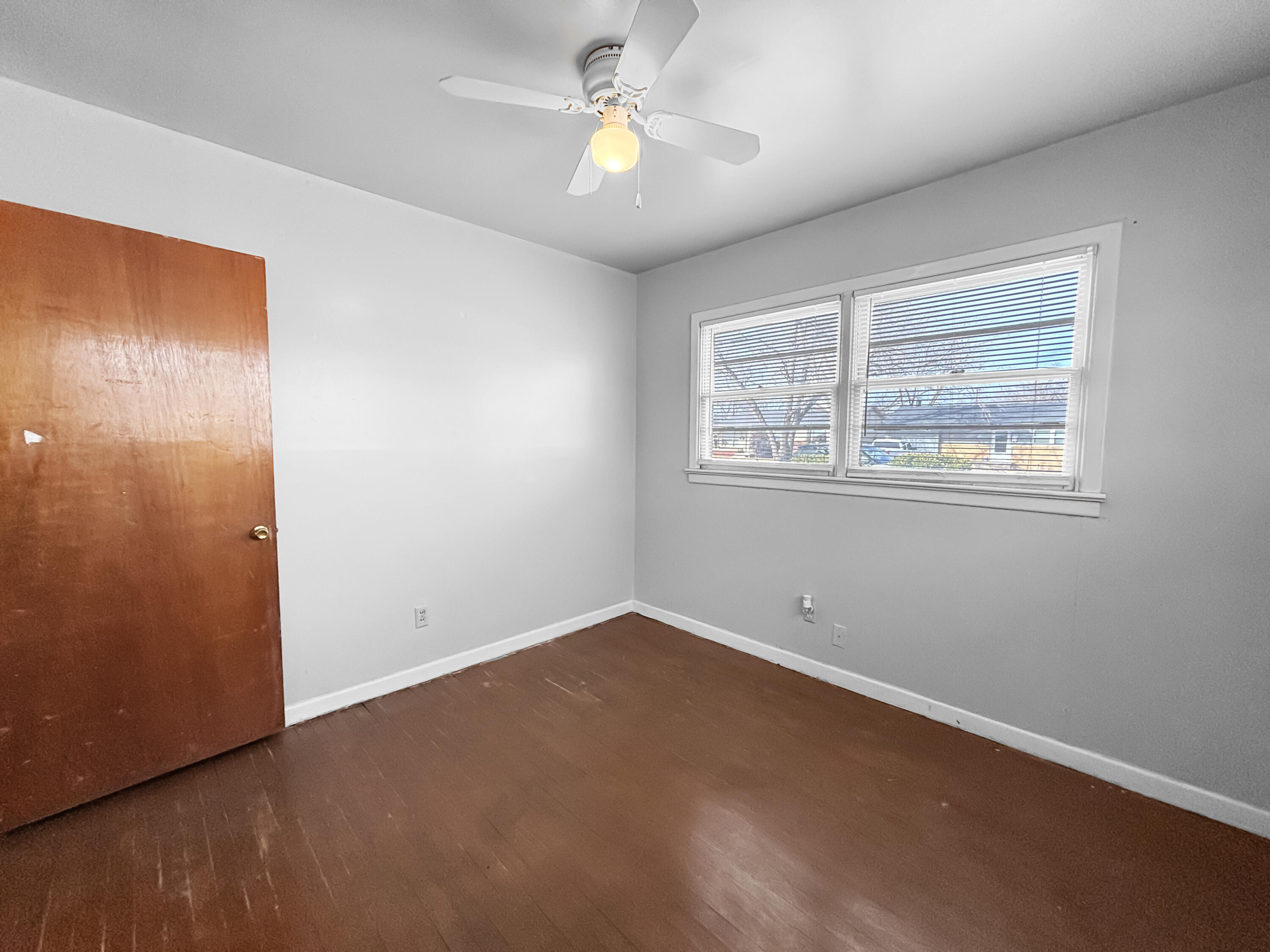 4411 45th Street Lubbock, TX 79414 - Photo 28 of 44 an empty room with closet and a chandelier fan