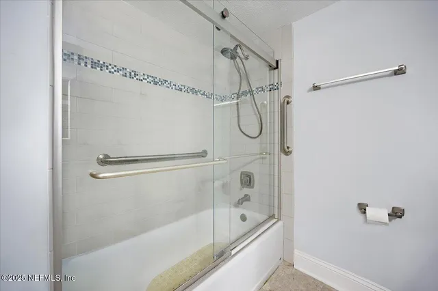 a bathroom with a shower and a bathtub