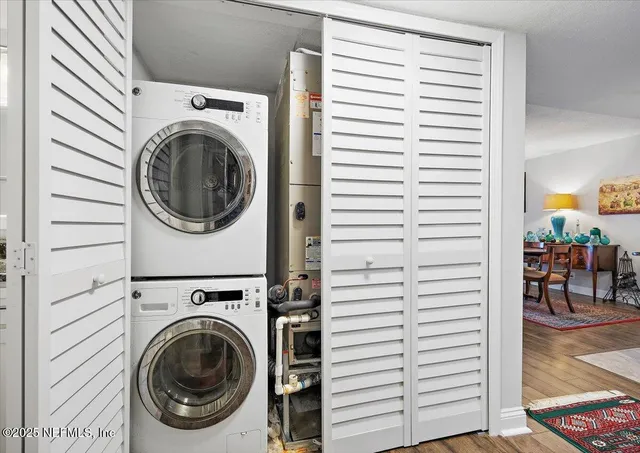 a view of a hallway with washer and dryer