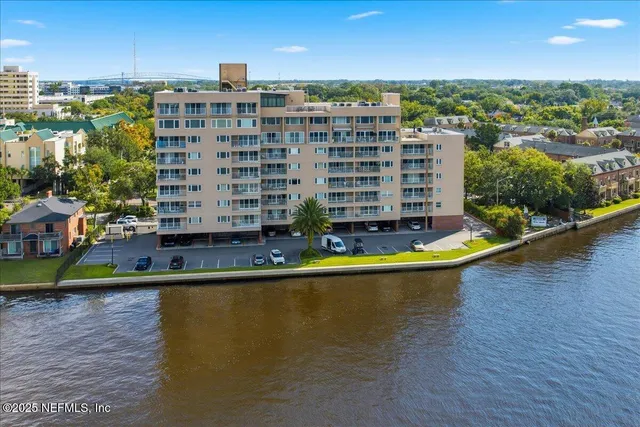 a view of building with swimming pool and outdoor space