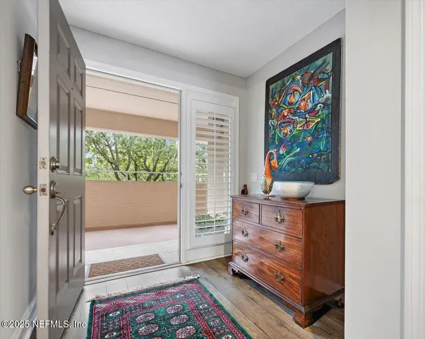 a living room with furniture and a dresser