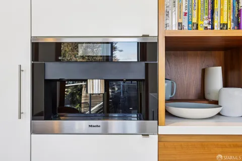 a view of living room with furniture and floor to ceiling windows