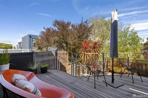 a view of a backyard with sitting area