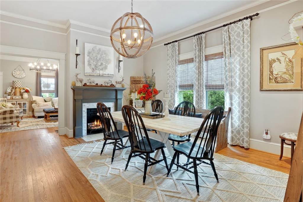 745 Washington Street Clarkesville, GA 30523 - Photo 12 of 54 a view of a dining room with furniture a chandelier and wooden floor
