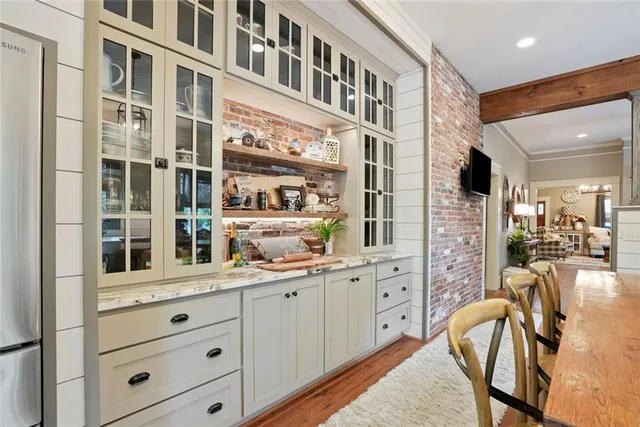 a very nice looking living room with a large window and furniture