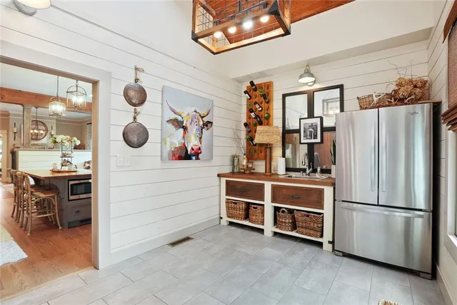 a kitchen with a refrigerator and a stove