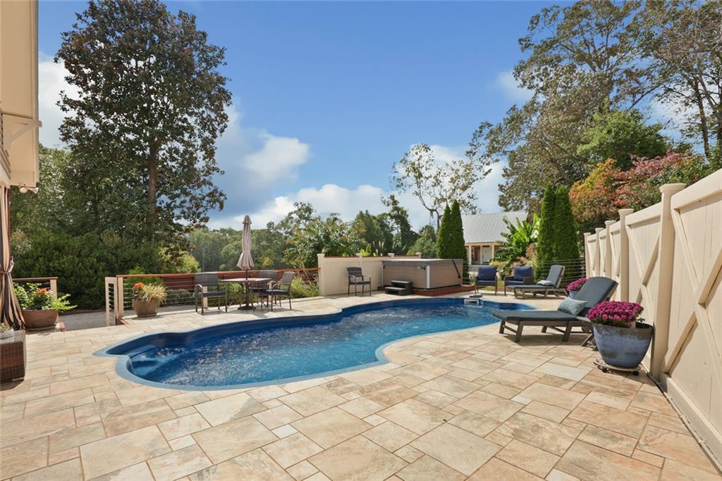 745 Washington Street Clarkesville, GA 30523 - Photo 19 of 54 a view of a swimming pool with a lounge chair