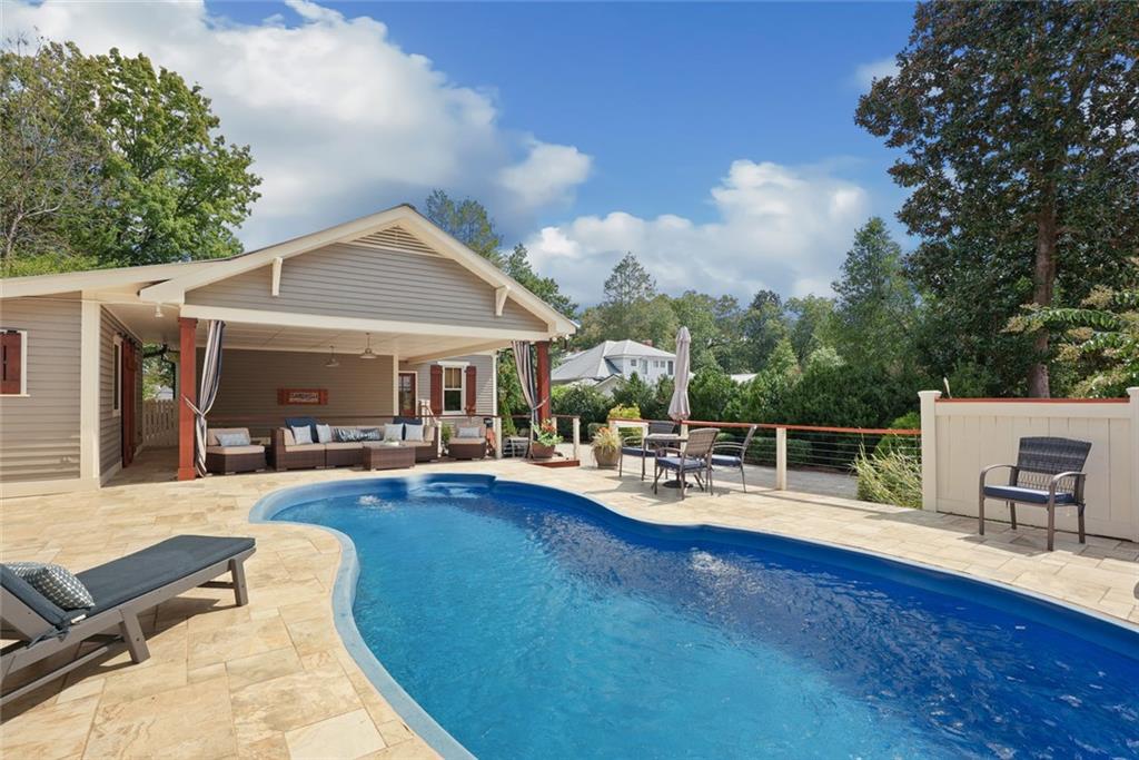 745 Washington Street Clarkesville, GA 30523 - Photo 20 of 54 a view of a house with swimming pool and sitting area