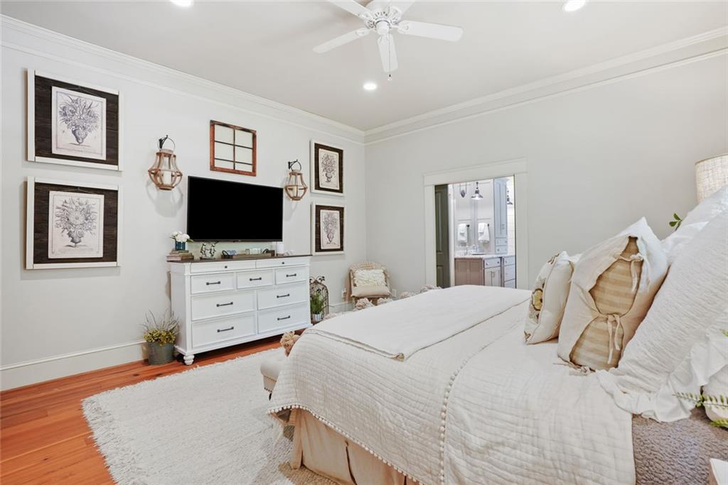 745 Washington Street Clarkesville, GA 30523 - Photo 29 of 54 a bedroom with a bed and flat screen tv