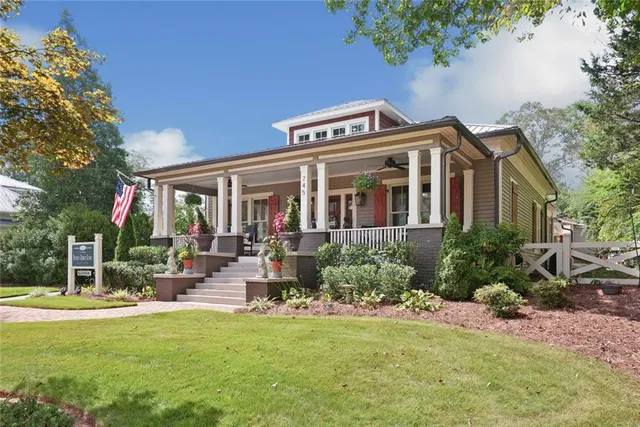 a front view of house with yard and outdoor seating