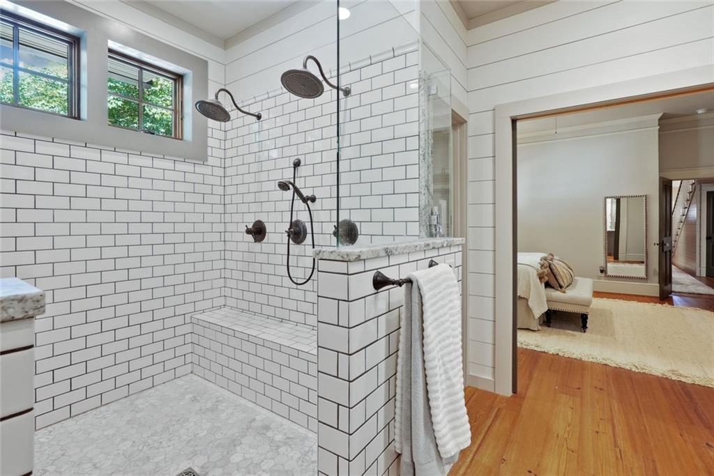 745 Washington Street Clarkesville, GA 30523 - Photo 31 of 54 a bathroom with a bathtub and a shower