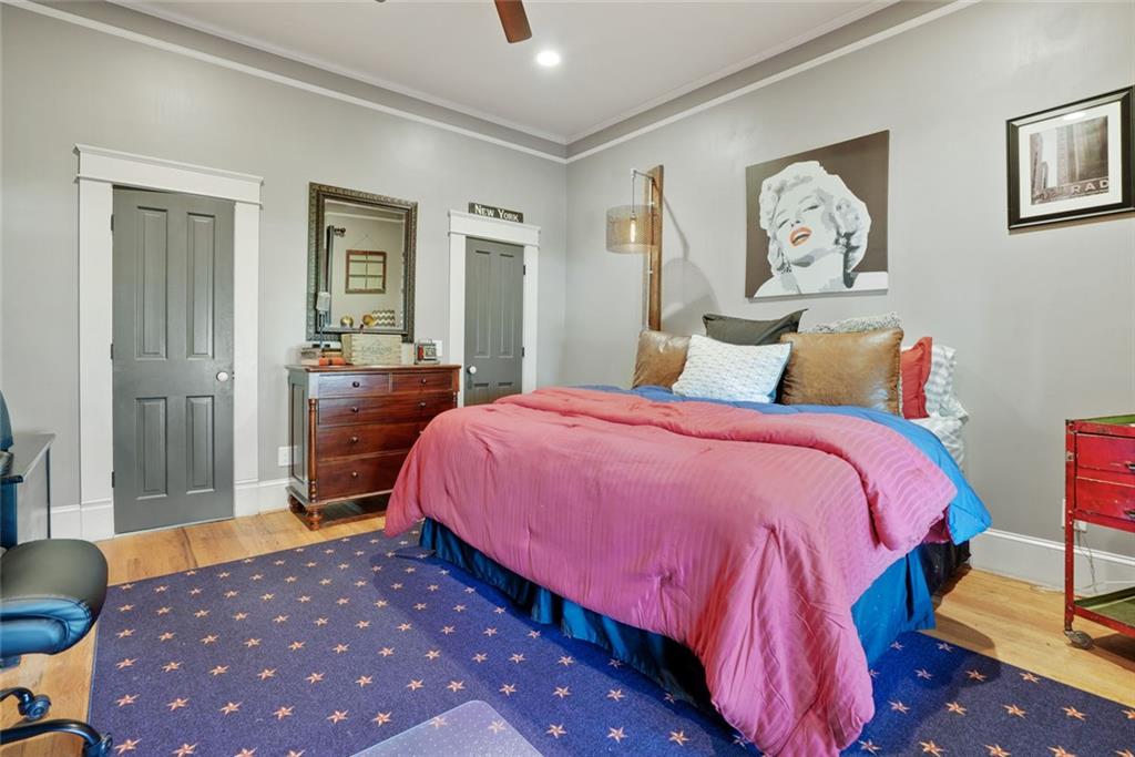 745 Washington Street Clarkesville, GA 30523 - Photo 38 of 54 a bedroom with a bed and painting on the wall