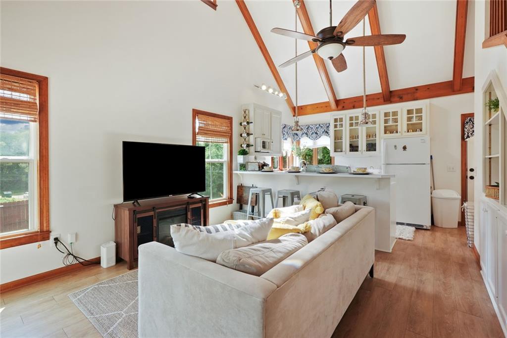 745 Washington Street Clarkesville, GA 30523 - Photo 44 of 54 a living room with furniture and a flat screen tv