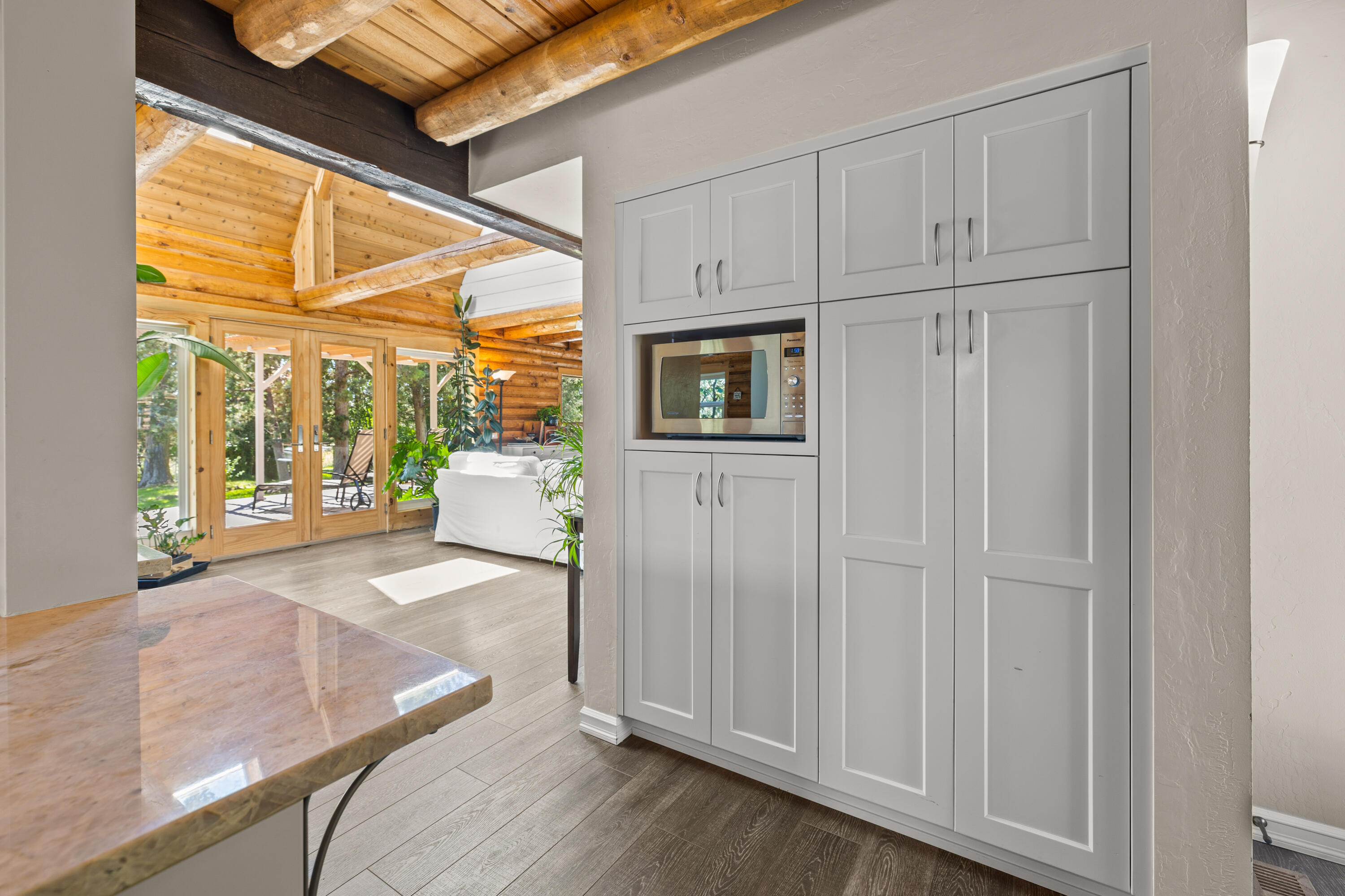 18460 Couch Market Road Bend, OR 97703 - Photo 11 of 51 a view of a room with wooden floor and windows