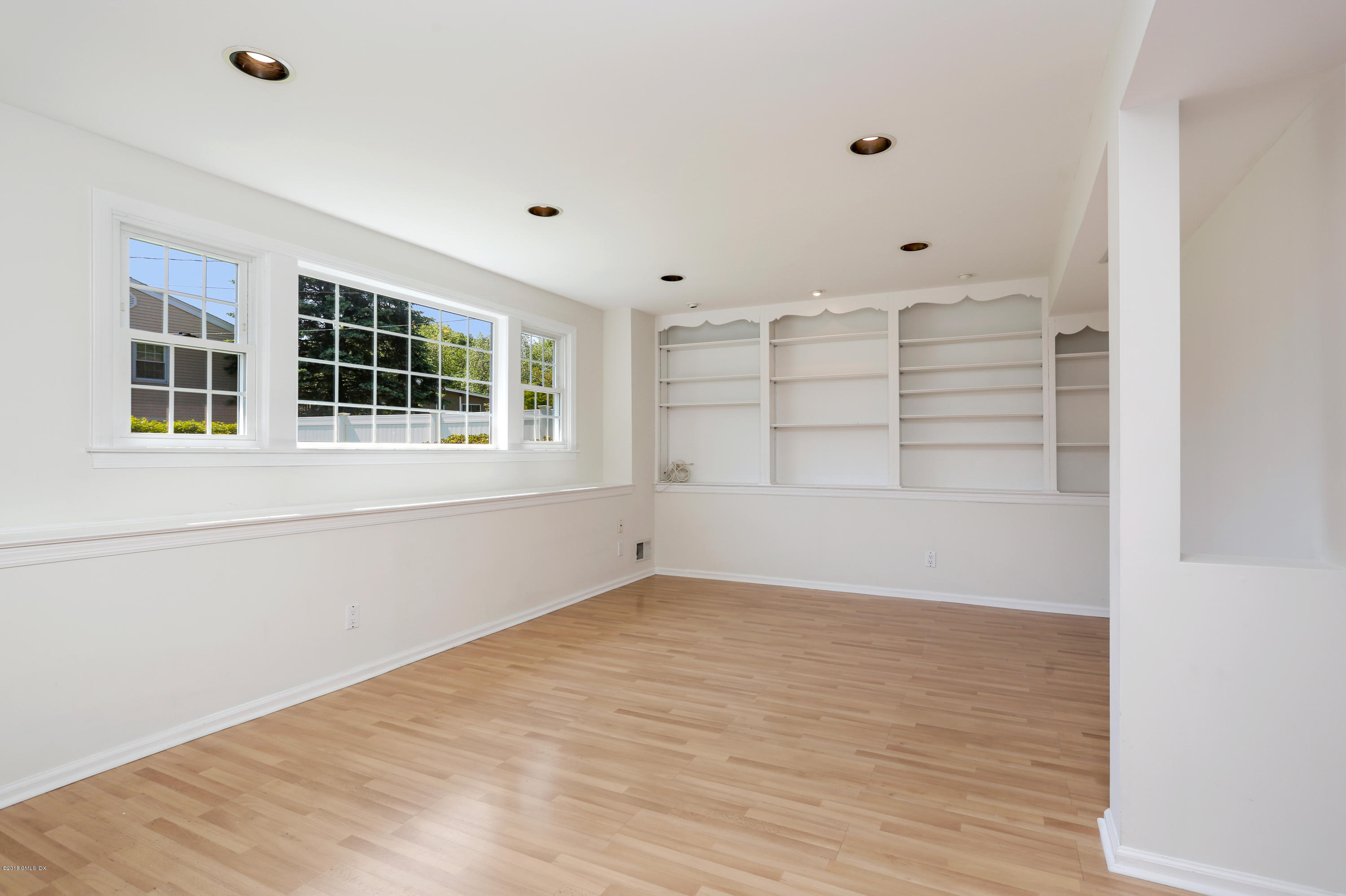 11 Surrey Drive Riverside, CT 06878 - Photo 10 of 20 a view of empty room with wooden floor and fan