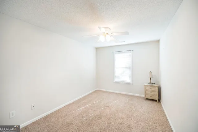a view of empty room with a window