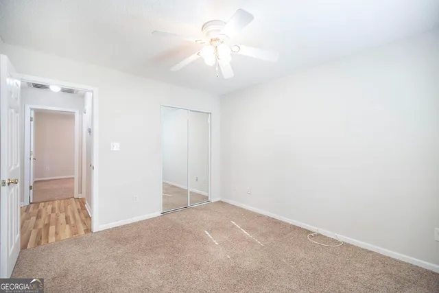 a view of a chandelier fan in a room