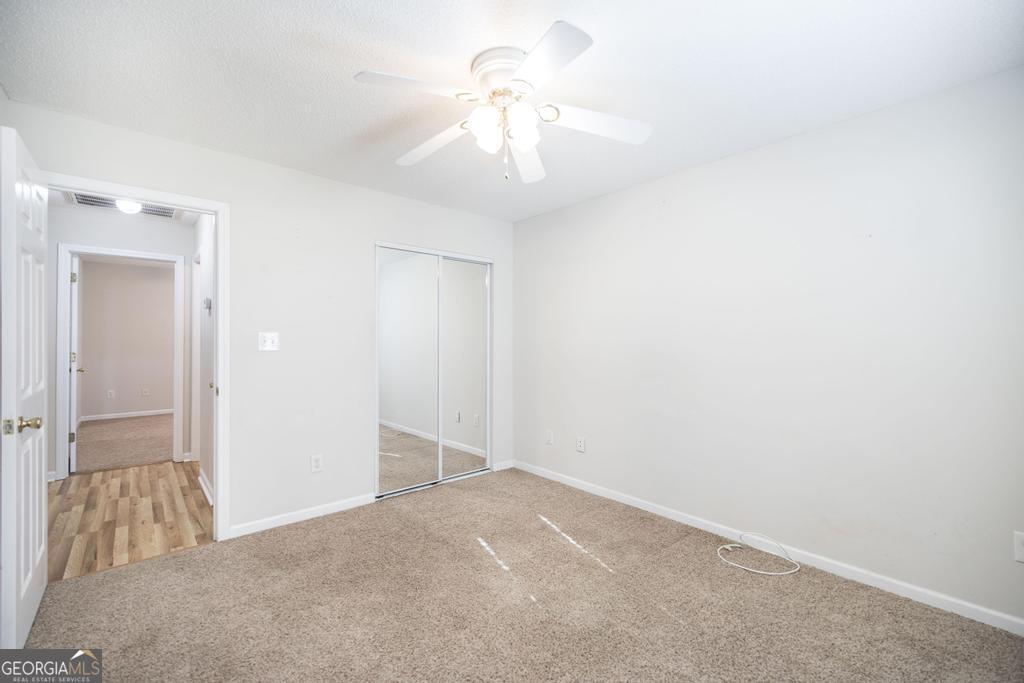 209 Mossy Ridge Warner Robins, GA 31088 - Photo 19 of 38 a view of a chandelier fan in a room