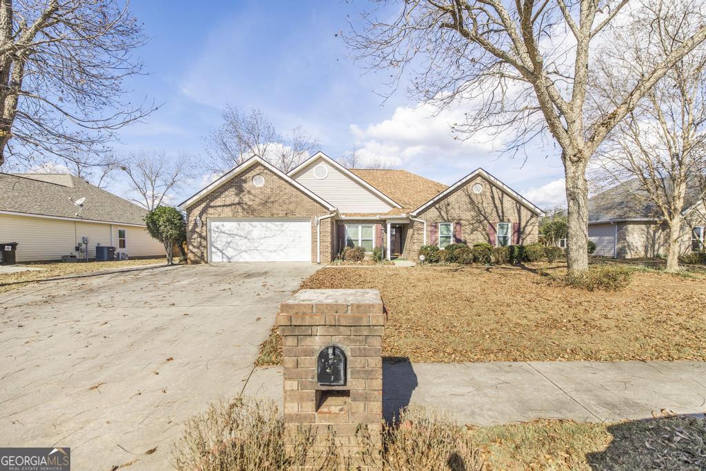 209 Mossy Ridge Warner Robins, GA 31088 - Photo 2 of 38 a view of house with snow on the road