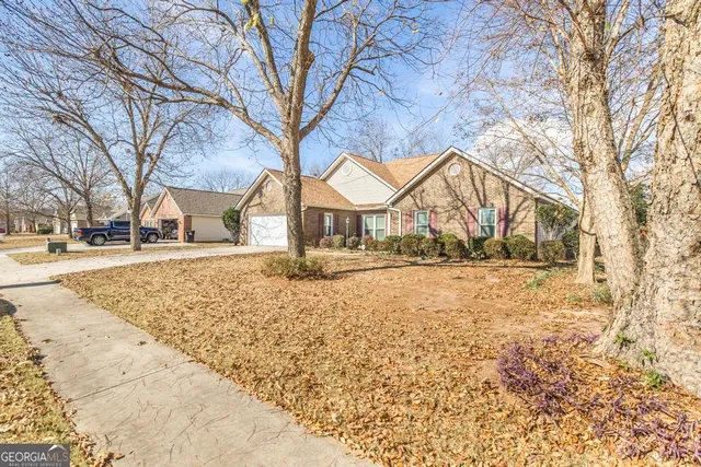 a house with trees in front of it