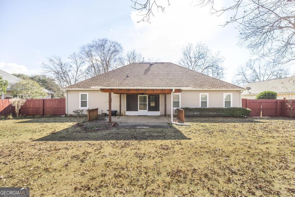209 Mossy Ridge Warner Robins, GA 31088 - Photo 35 of 38 a front view of a house with a yard and garage