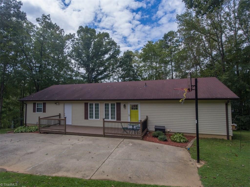 408 Brown Road King, NC 27021 - Photo 20 of 29 Detached apartment/in-law suite with 4-bay workshop garage on bottom level. Second door to left is for entrance into storage room being used presently as a craft room.