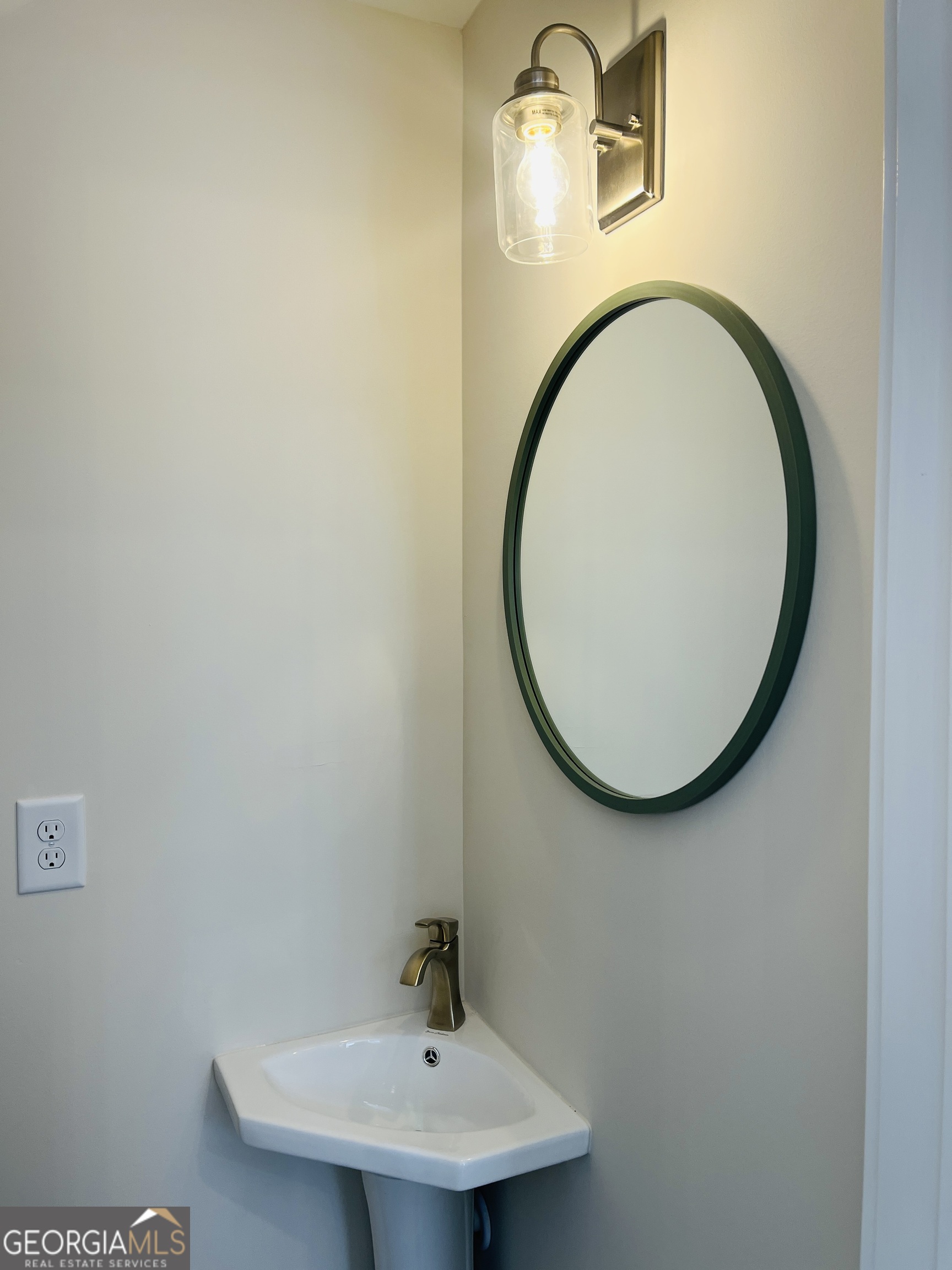 100 Gardenia Lane, Unit 100B LaGrange, GA 30240 - Photo 13 of 21 a bathroom with a sink and a mirror