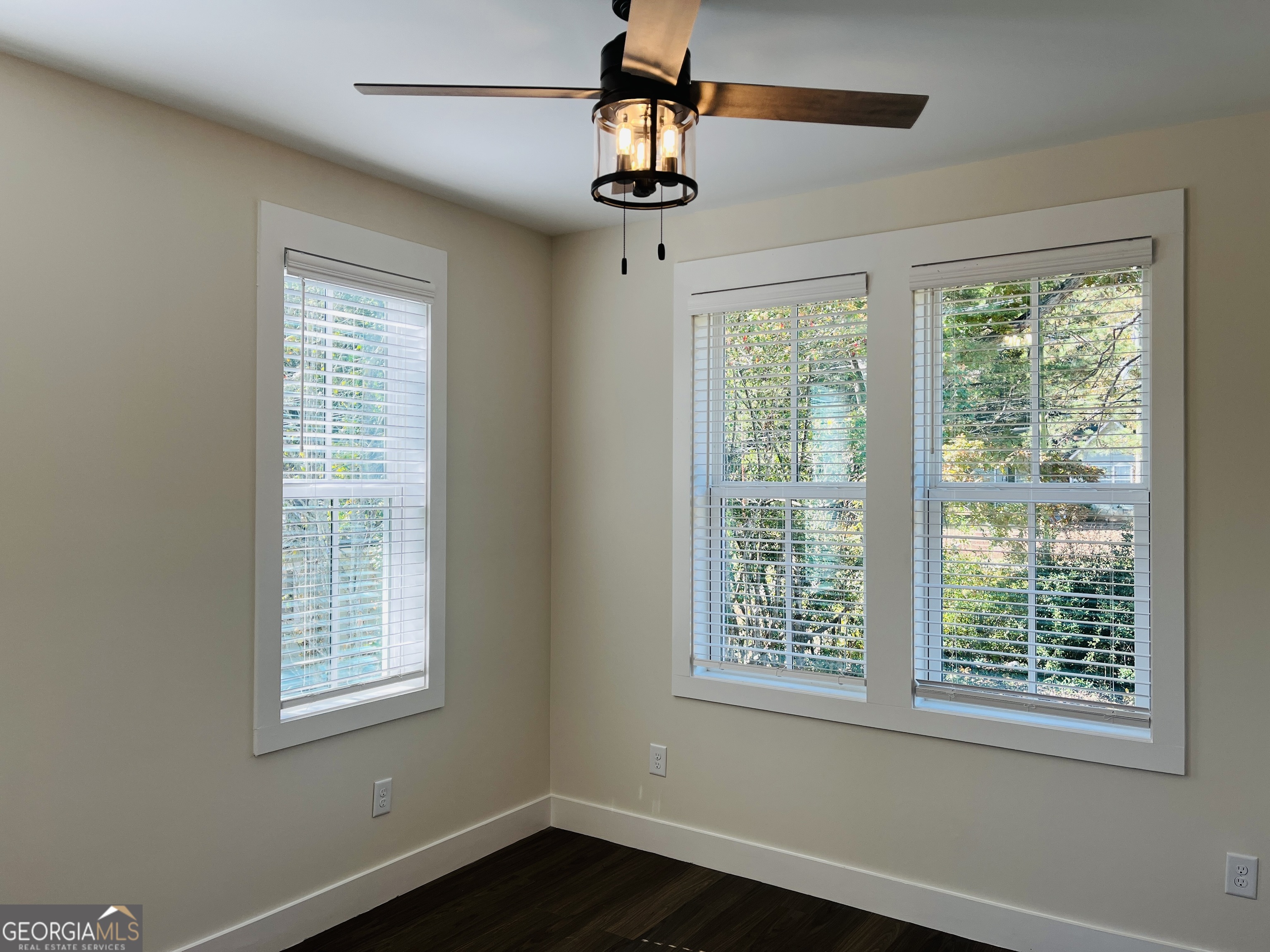 100 Gardenia Lane, Unit 100B LaGrange, GA 30240 - Photo 16 of 21 a view of an empty room with wooden floor and a window