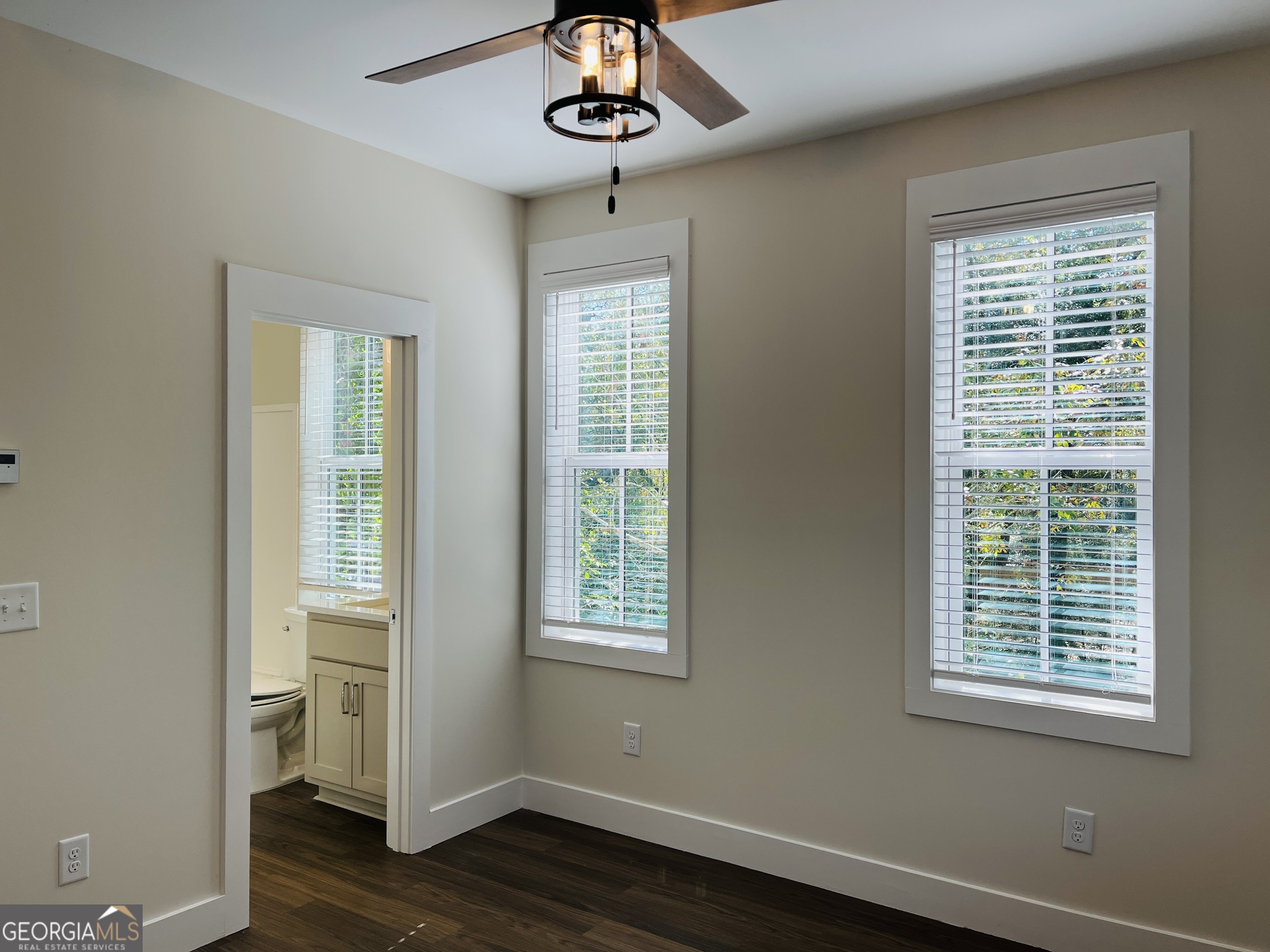 100 Gardenia Lane, Unit 100B LaGrange, GA 30240 - Photo 19 of 21 a view of an empty room with a window and wooden floor