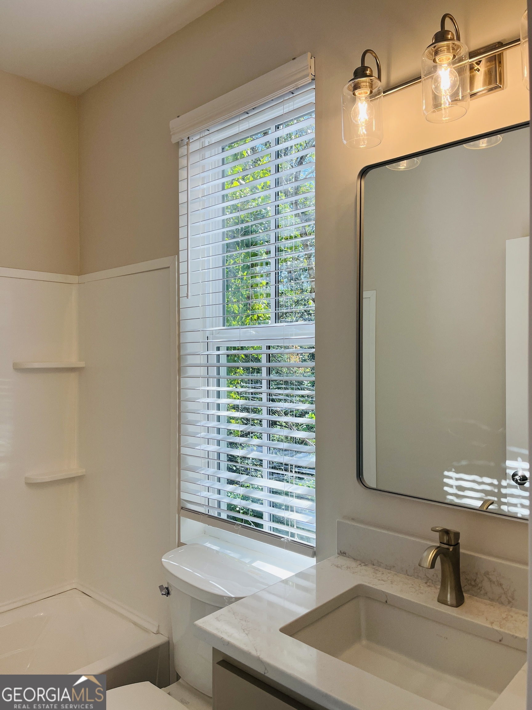 100 Gardenia Lane, Unit 100B LaGrange, GA 30240 - Photo 20 of 21 a bathroom with a sink and a window