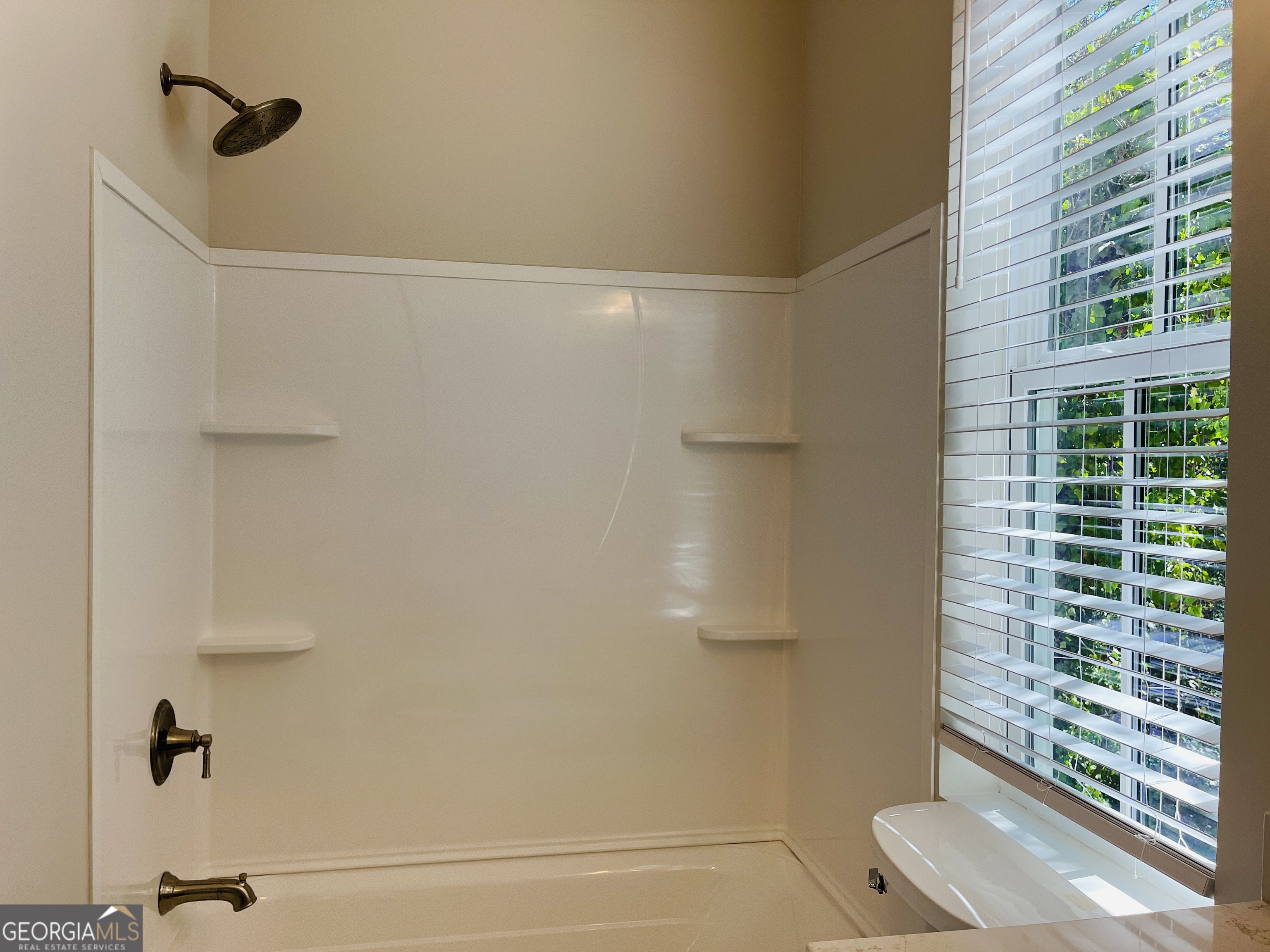 100 Gardenia Lane, Unit 100B LaGrange, GA 30240 - Photo 21 of 21 a bathroom with a shower and a sink