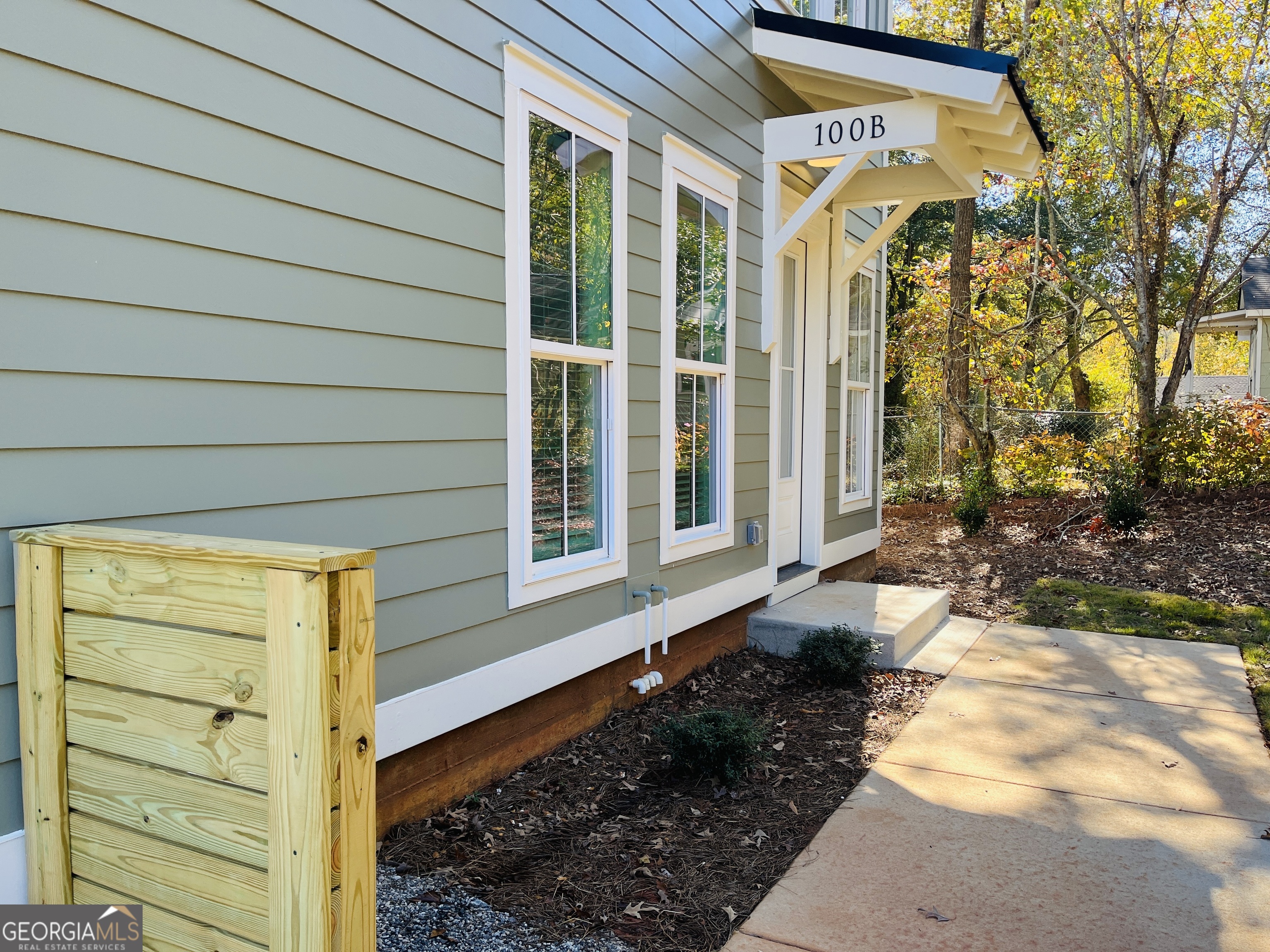 100 Gardenia Lane, Unit 100B LaGrange, GA 30240 - Photo 5 of 21 a front view of a house with a yard
