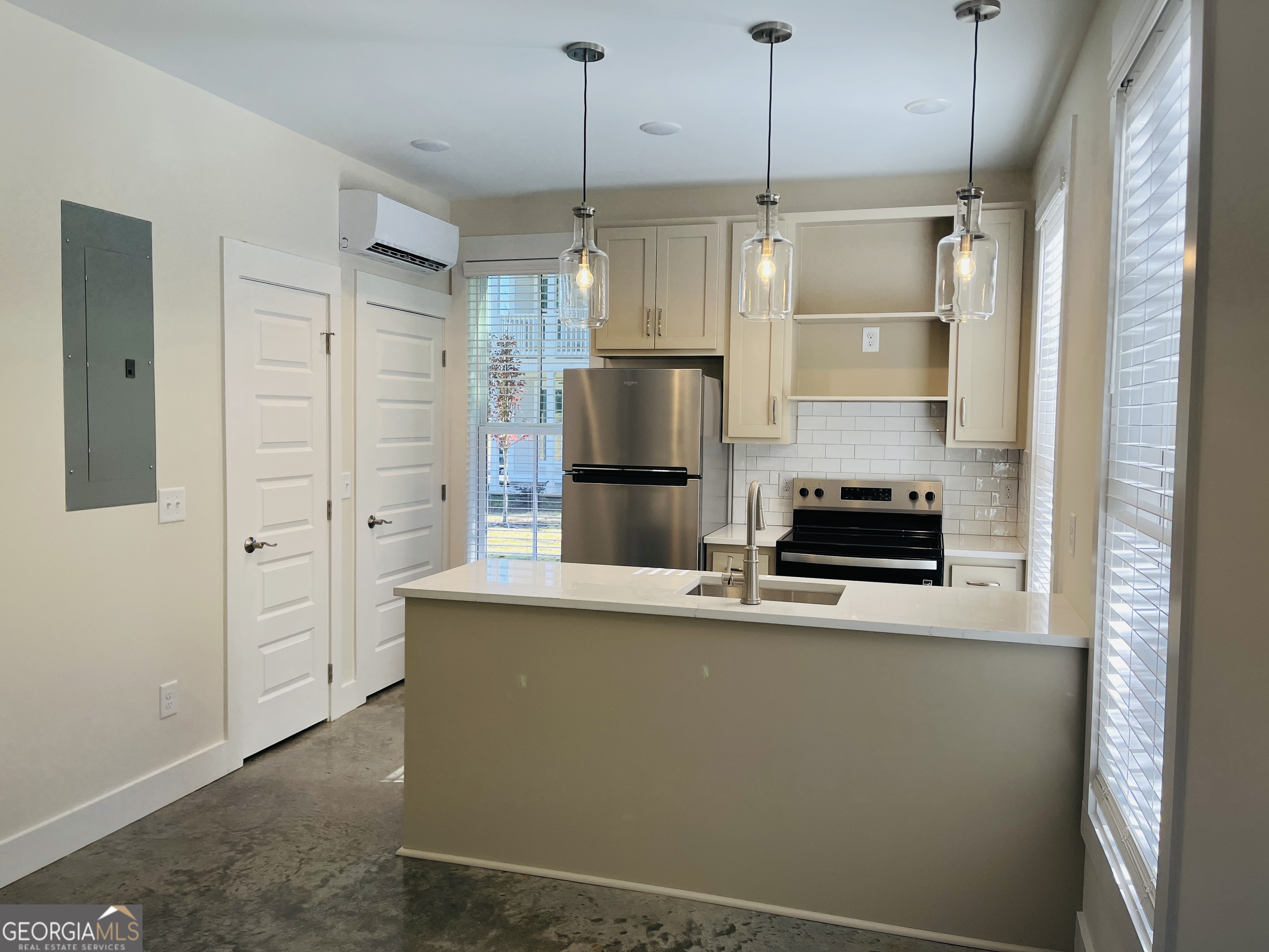 100 Gardenia Lane, Unit 100B LaGrange, GA 30240 - Photo 8 of 21 a kitchen with stainless steel appliances a refrigerator and a stove