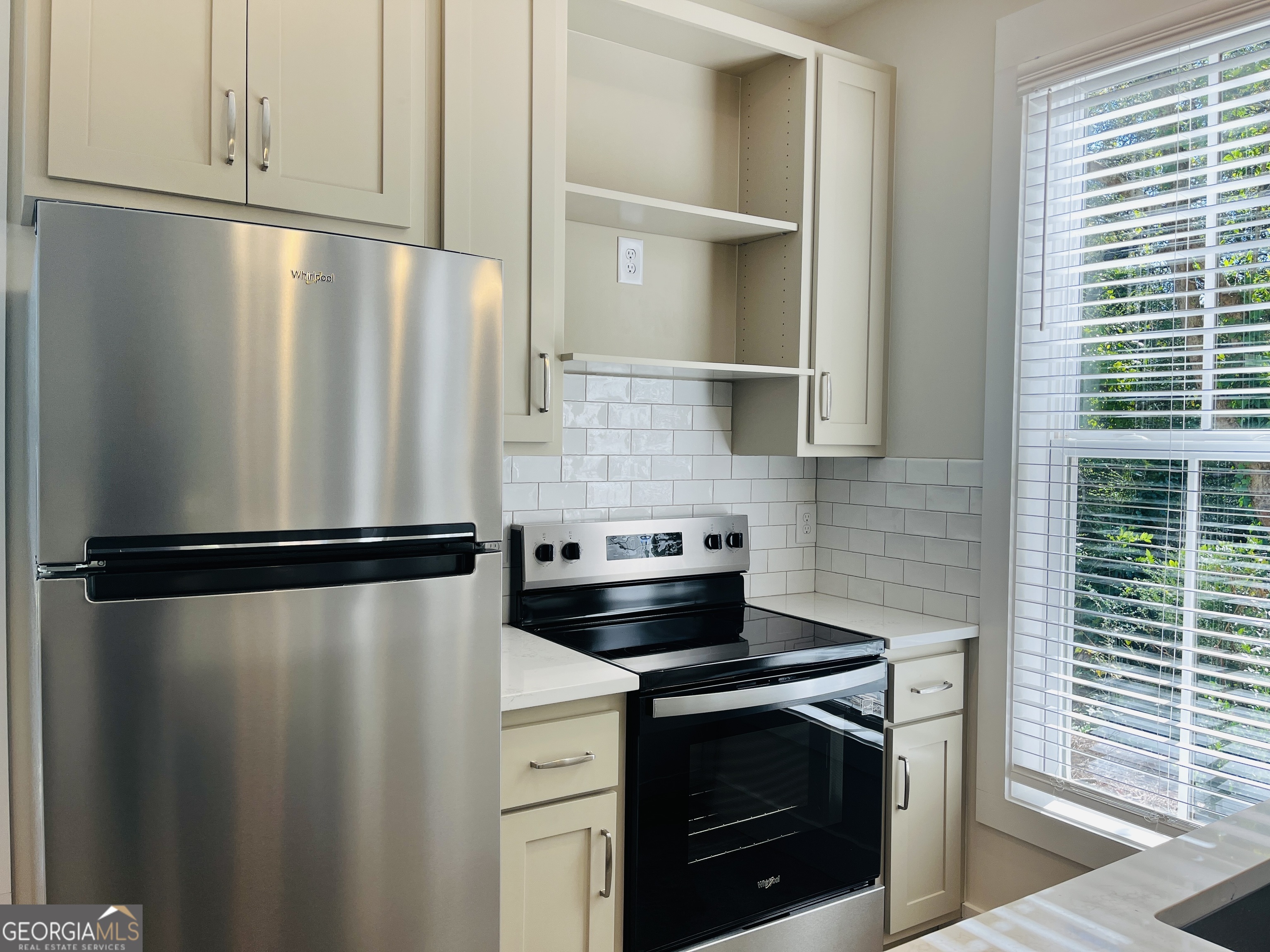 100 Gardenia Lane, Unit 100B LaGrange, GA 30240 - Photo 10 of 21 a view of a stove top oven and cabinets