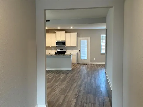 a view of kitchen with wooden floor