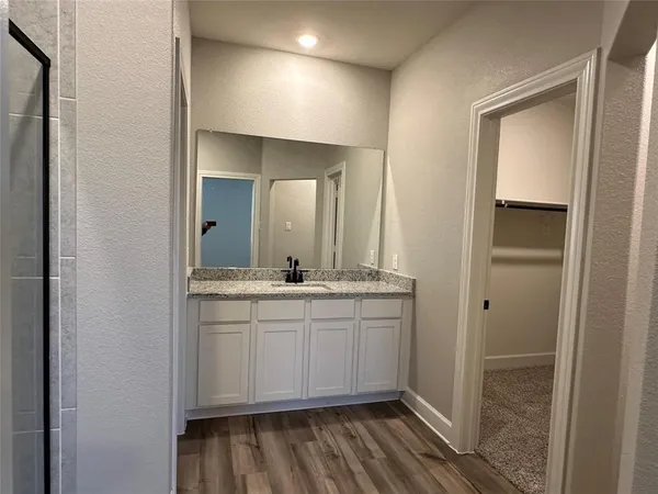 a bathroom with 2 sink and a mirror