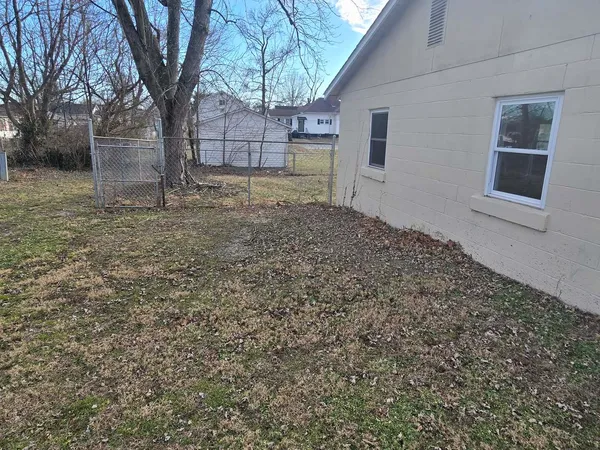 a backyard of a house with lots of green space