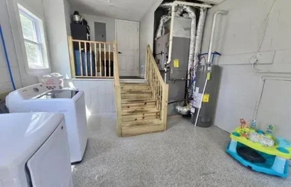 a view of a livingroom with furniture and toys