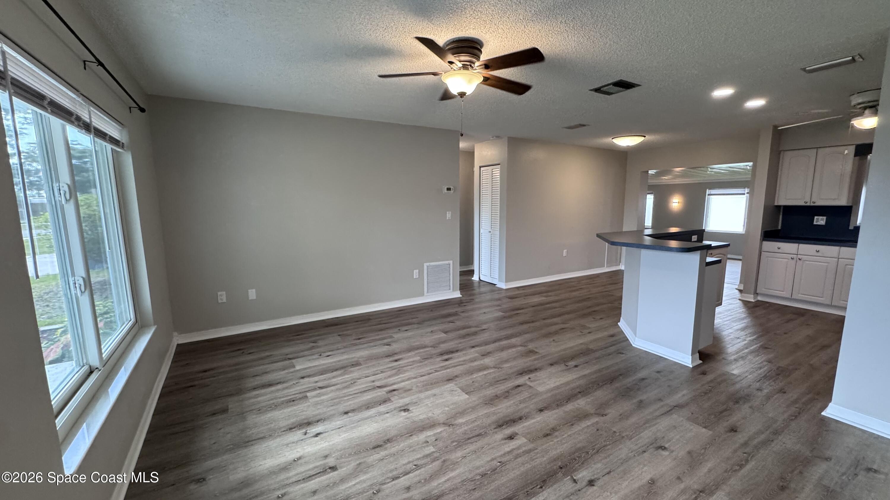 2137 Laden Road Melbourne, FL 32935 - Photo 5 of 23 a kitchen with stainless steel appliances granite countertop a refrigerator and a stove