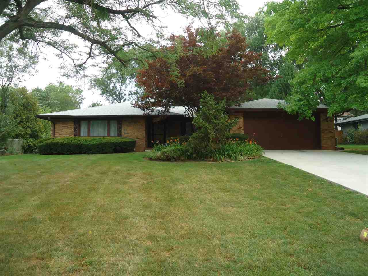5224 Brookview Road Rockford, IL 61107 - Photo 1 of 22 a front view of a house with a garden